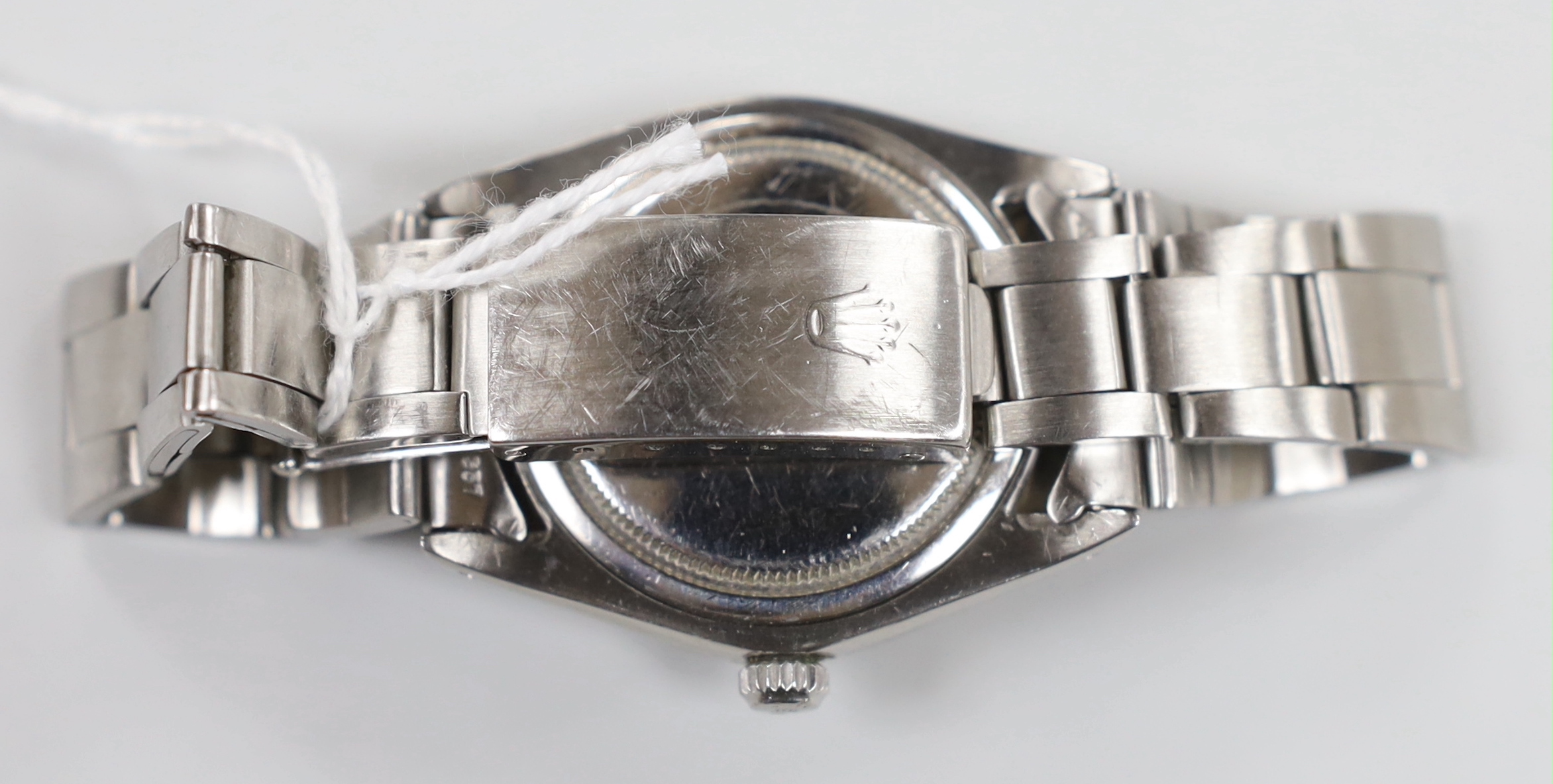 A gentleman's 1970's stainless steel Rolex Oysterdate precision wrist watch, with yellow dial, on a stainless steel Rolex bracelet, model number 6694 serial no. 3737889, no box or papers, case diameter 35mm.